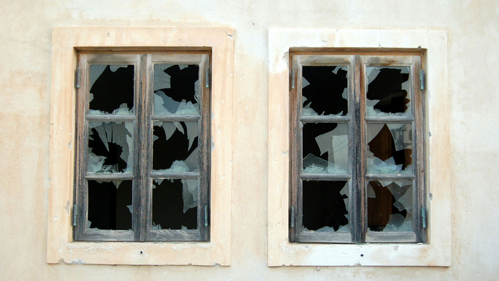 A set of broken windows representing unhealed wounds in relationships and attracting the wrong people.