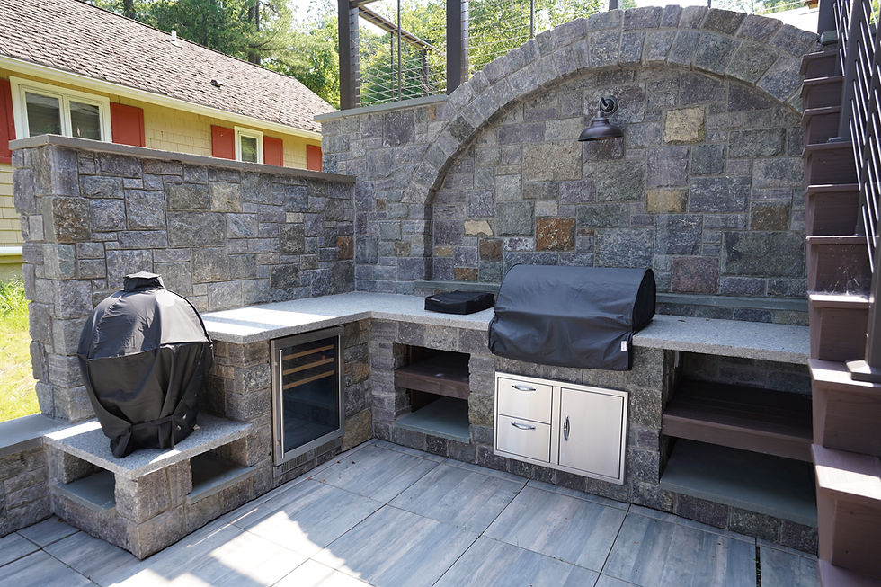 Exterior Kitchen with fridge, shelving, grill, and smoker pit