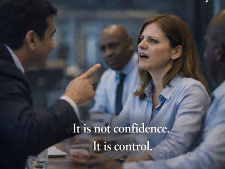 Being interrupted in meetings workplace bullying scenario showing a professional woman being spoken over in a meeting, representing loss of voice and psychological safety.