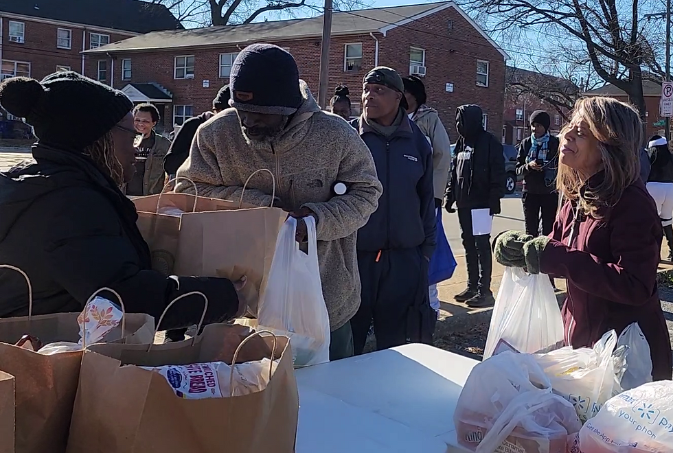 Feeding the Multitude. "Free Groceries Giveaway" to families in need.