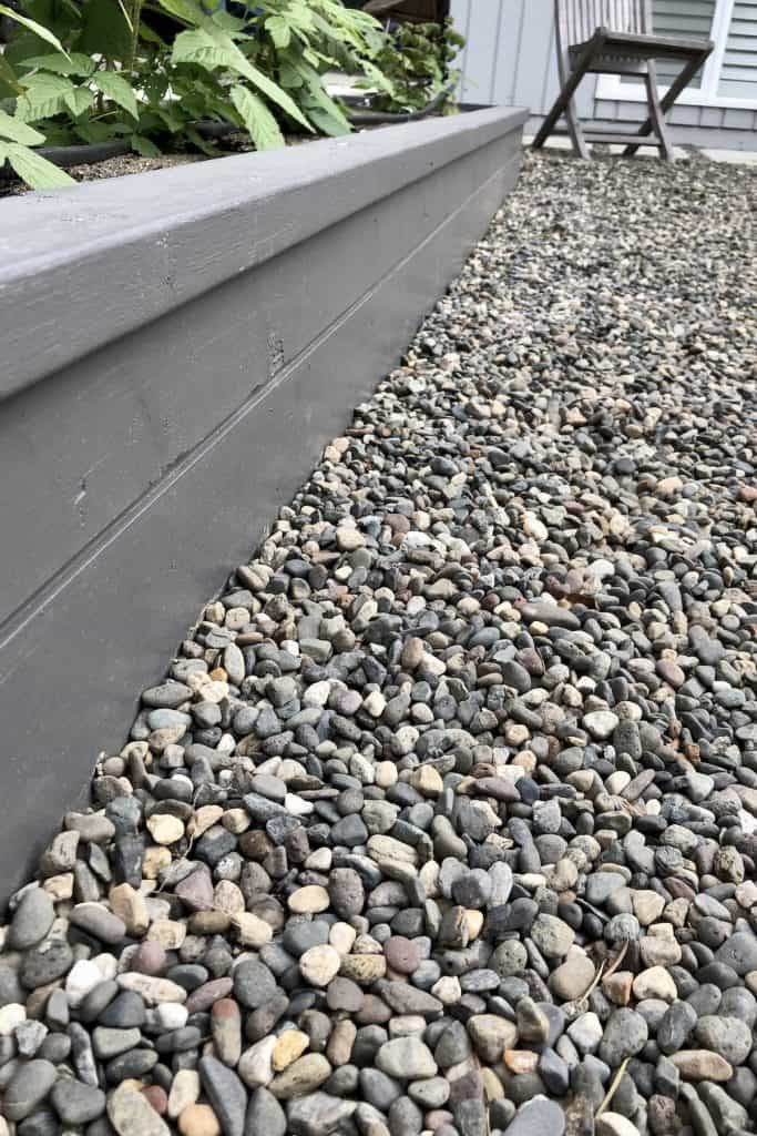 pea gravel beside planter