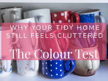 Colorful mugs on a shelf behind pink overlay text reading Why Your Tidy Home Still Feels Cluttered: The Colour Test