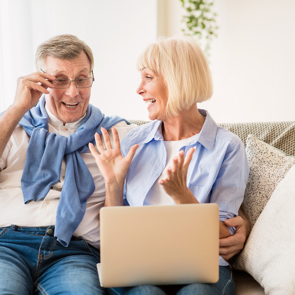 Happy senior couple using laptop to manage online estate sale