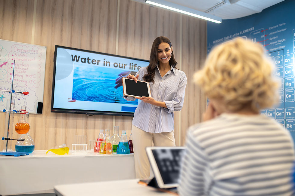 woman-pointing-finger-tablet-screen-showing-students.jpg