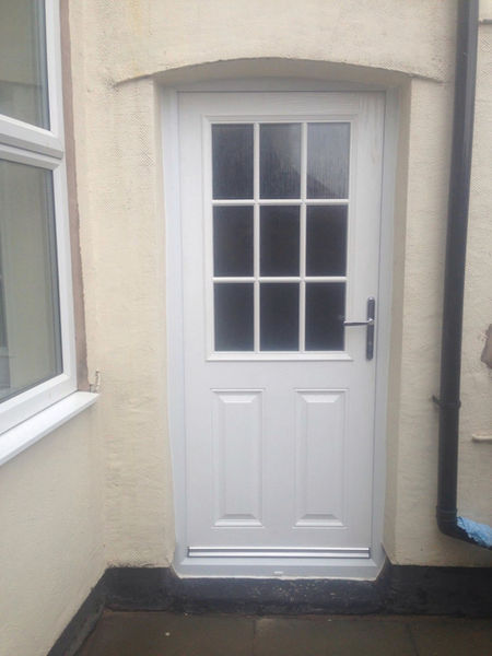 white PVC door with panel windows