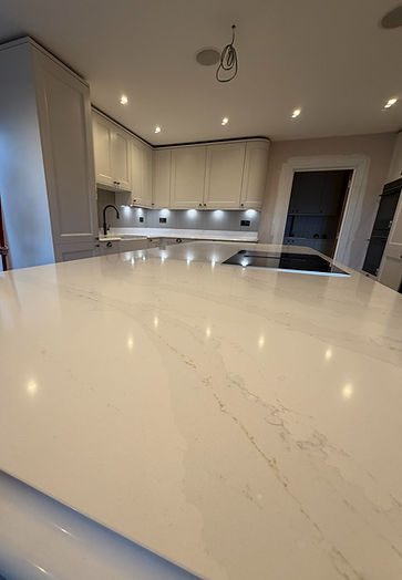 A modern kitchen with sleek white countertops