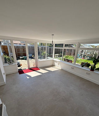 extension inside view with windows to a garden