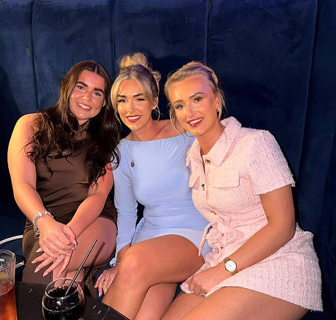 3 girls sat at a table in the bar