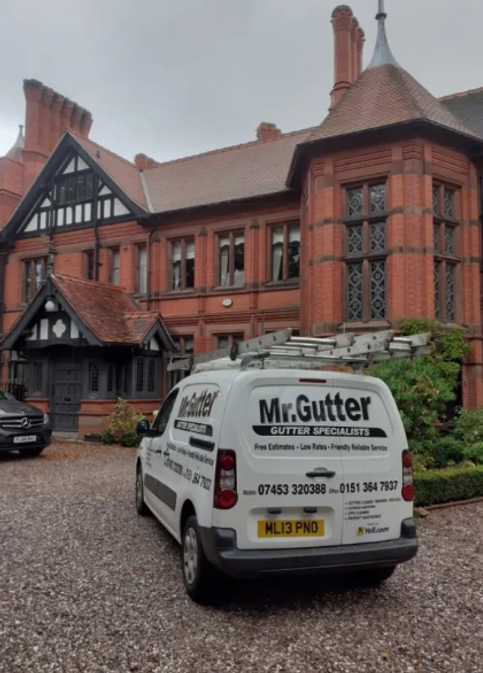 mr gutter van outside a large property