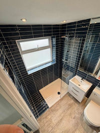 black tiled shower room