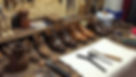 cobblers workbench showing tools and work in progress. No person present..jpg