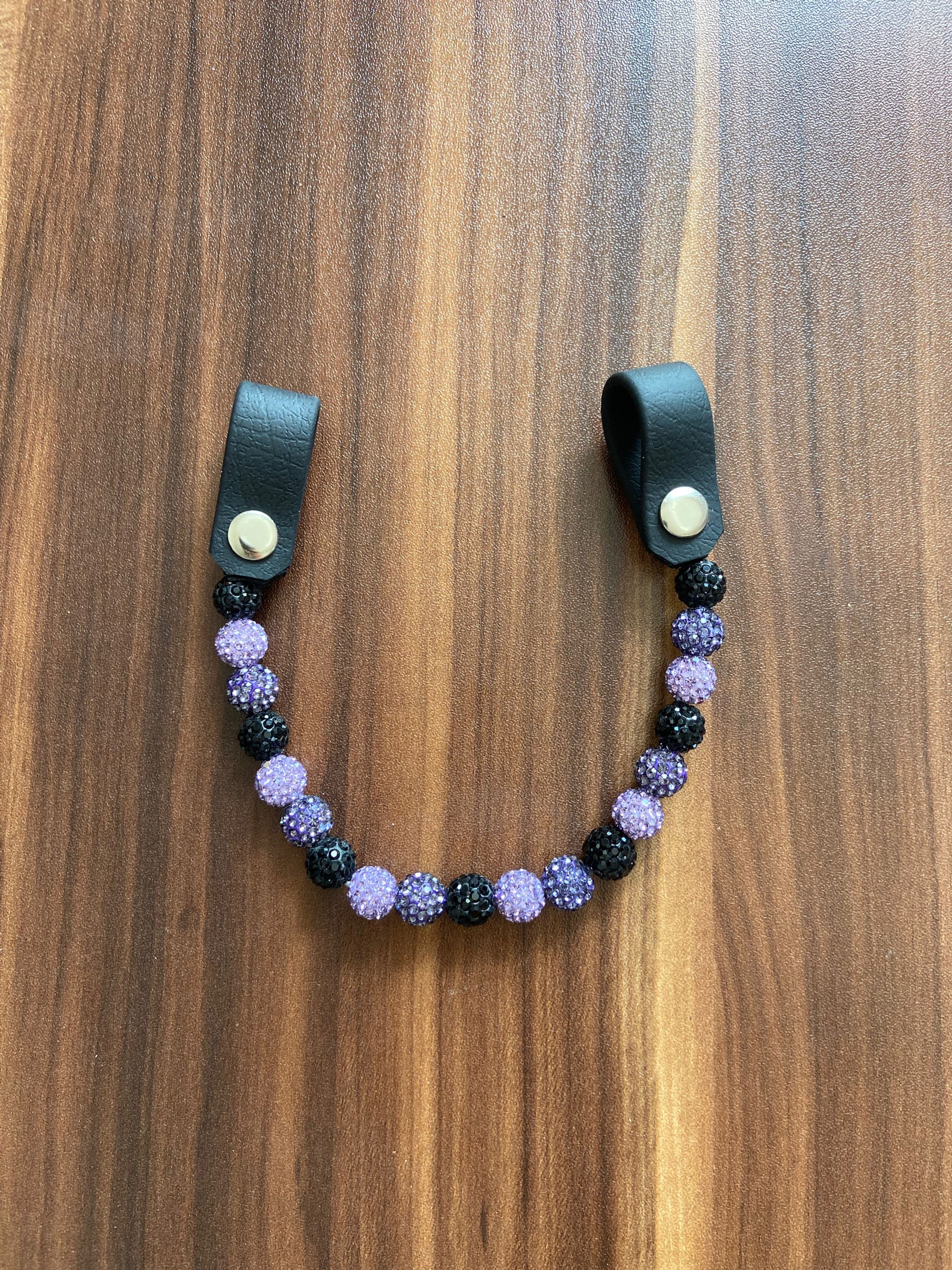Earloop in schwarz/lila/flieder