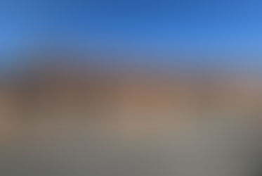 Rénovation des menuiseries : portes, fenêtres et volets bois remplacés par du PVC gris anthracite double vitrage et volets roulants électriques.