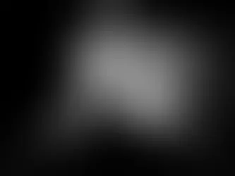 Silhouette of a person ascending an escalator towards a cloudy sky, framed by dark walls. Dramatic contrast in black and white.