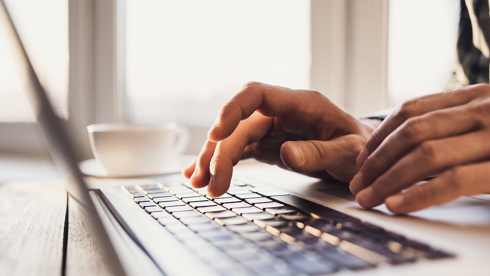 A laptop and hands indicating email marketing agency services