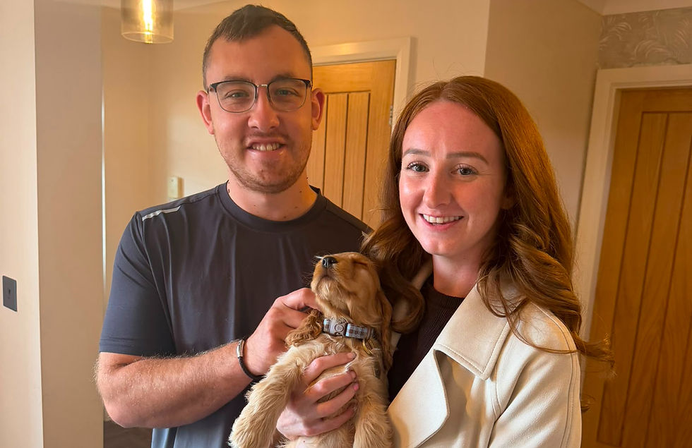 Bear with Becky and Jonny, ready to begin his new life alongside fellow Greavesamor Cocker Spaniel, Buzz.