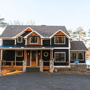 5- exterior view of a custom home in Blairsville, GA overlooking Lake Nottely. Multiple levels of a outdoor covered deck.