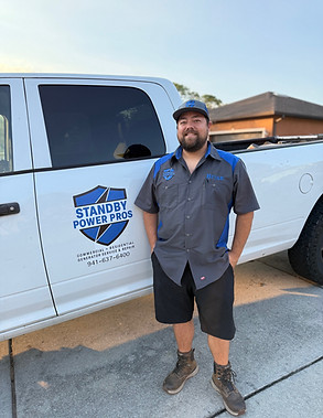 Our Owner standing next to his work vehicle