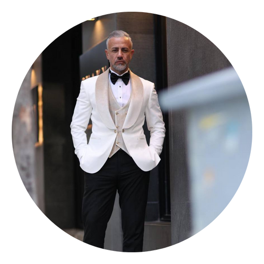 A cream dinner jacket, shot close.
