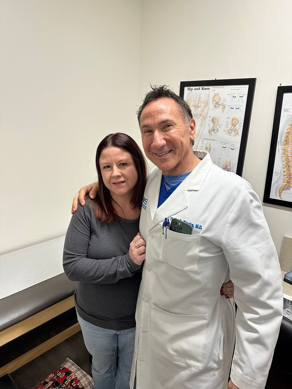 Ivy is standing with her amazing Spinal Surgeon, Dr. Philip G. Ploska of Regenerative Orthopaedics & Spine Institute.
