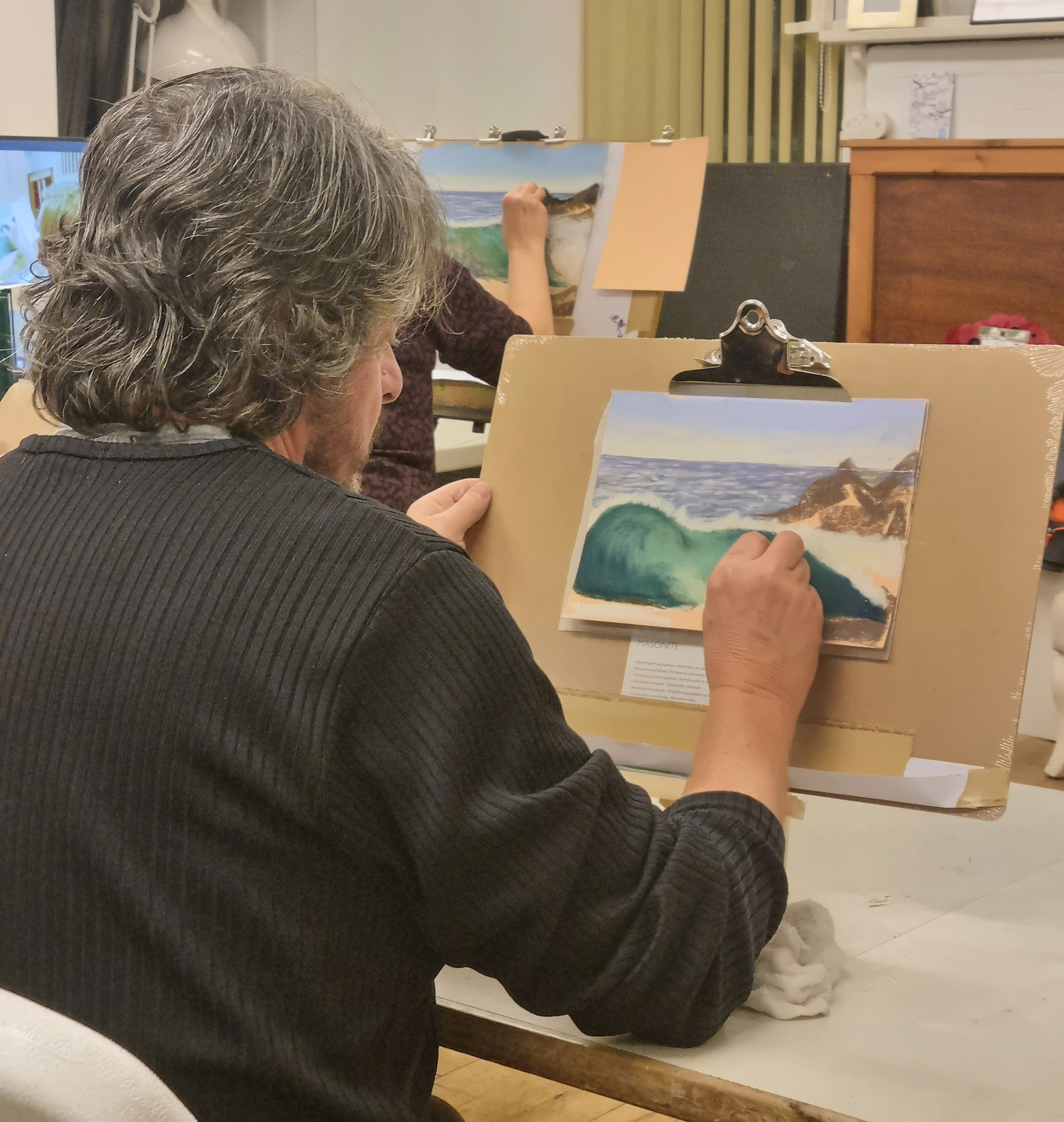 Artist painting a coastal landscape, Barrow Society of Artists