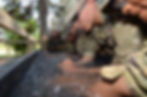 Military personnel immersing forearms in water