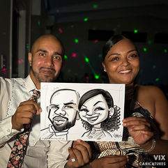 Couple with their caricature drawn at a wedding by Vix Caricatures