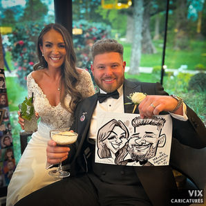 Couple with their caricature drawn at a wedding by Vix Caricatures