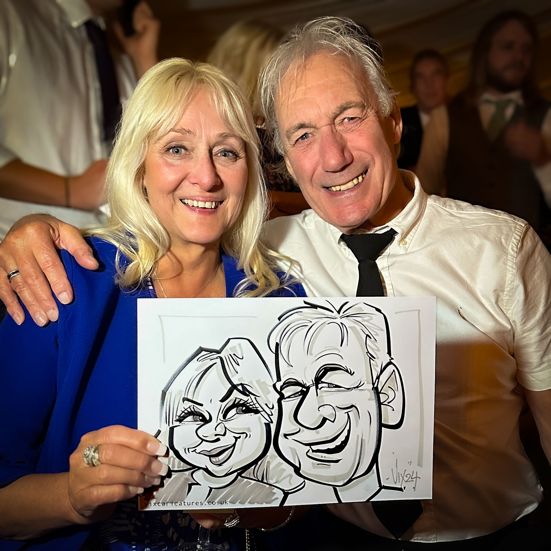 Professional Caricaturist entertains at a wedding in the Midlands drawing super fast sketches of the guests as well as the bride and groom by Vix Caricatures