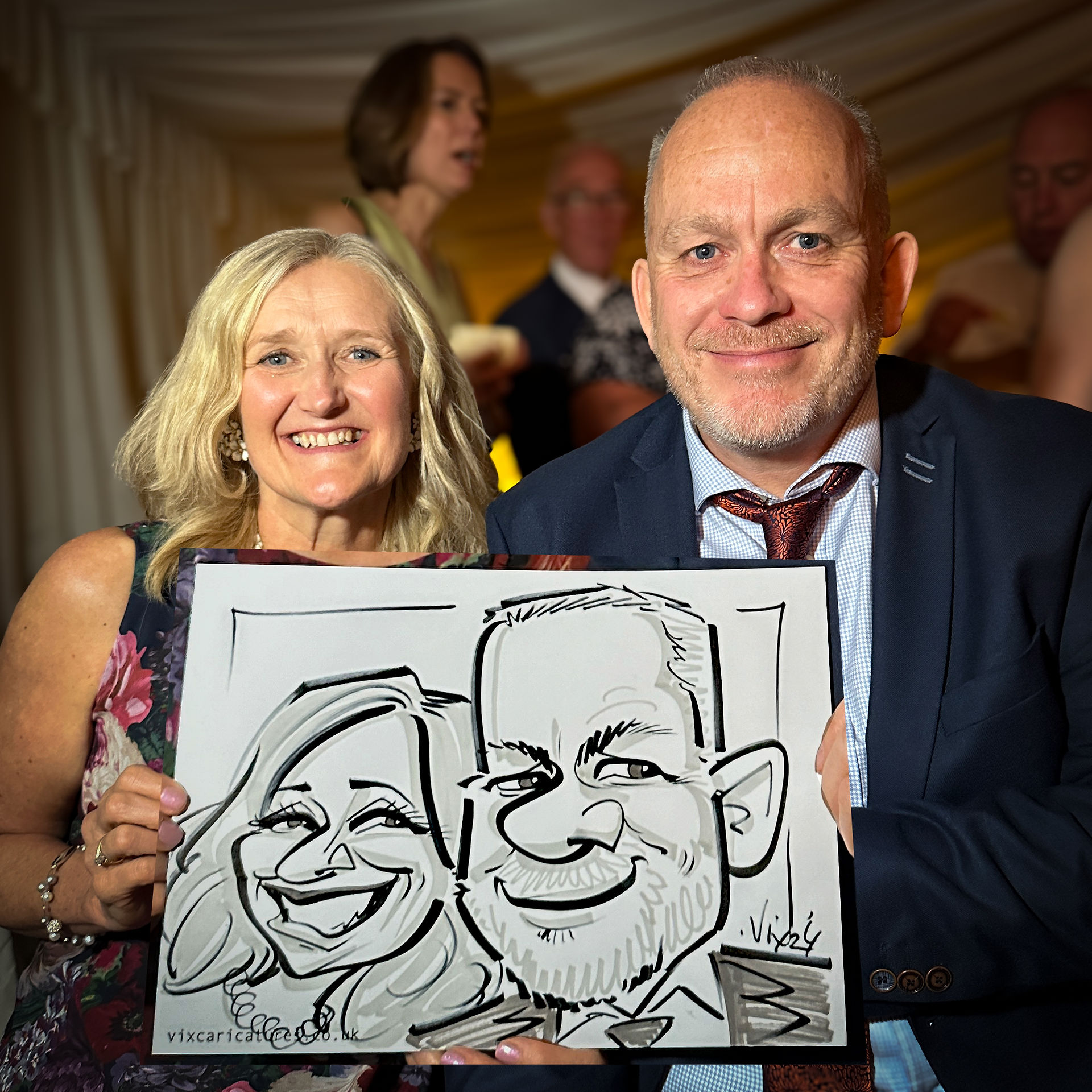 Professional Caricaturist entertains at a wedding in the Midlands drawing super fast sketches of the guests as well as the bride and groom by Vix Caricatures
