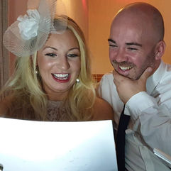 couple with their caricature drawn on the spot by Vix Caricatures at a wedding