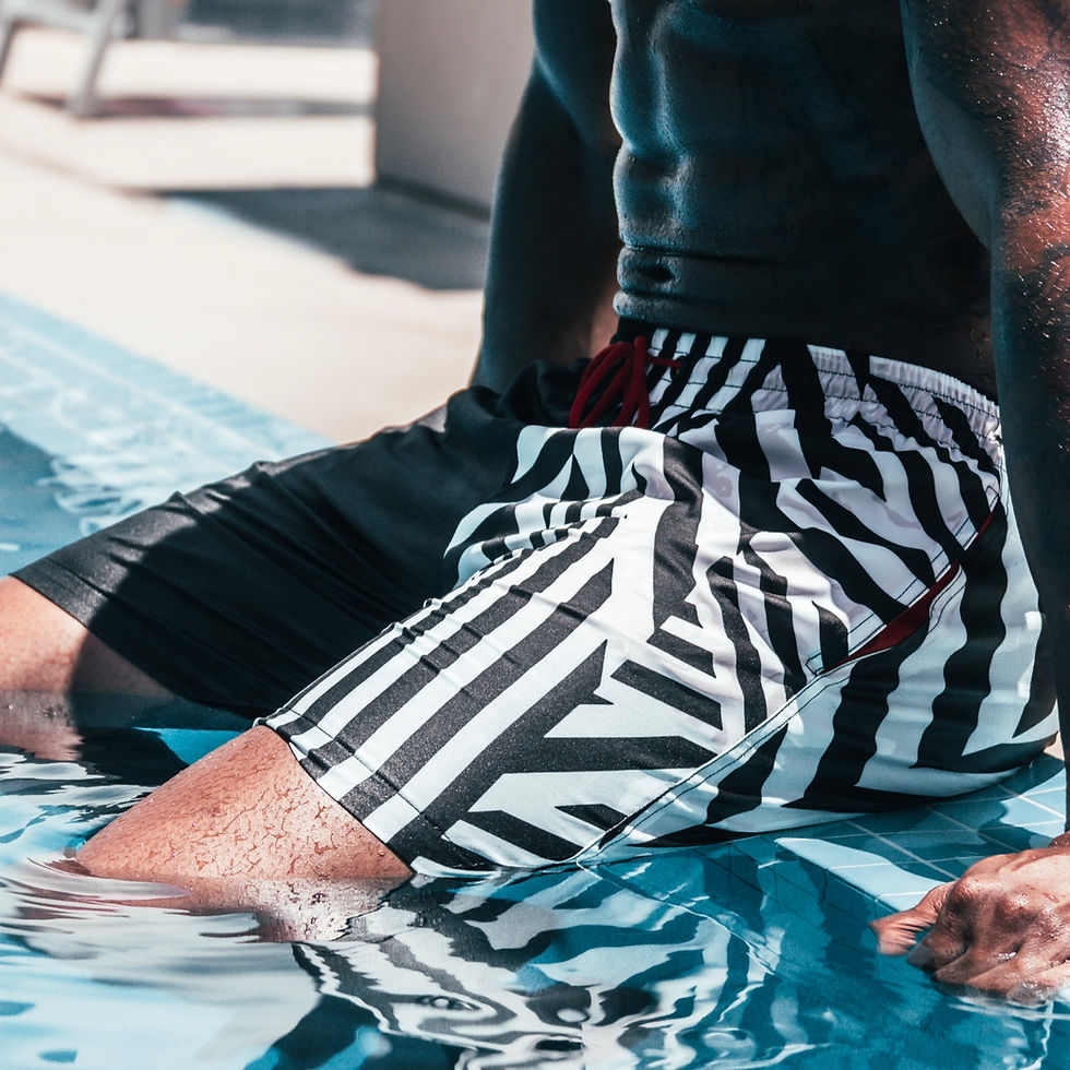 Thumbnail: model in pool wearing zig zag swim trunks hollywood hamilton clothing tampa mens bathing suits