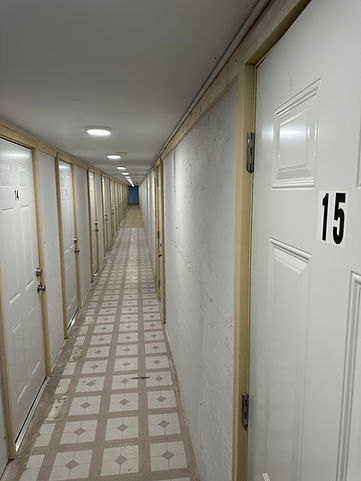 Hallway of indoor storage units at Lake Ripley Apartments in Litchfield, MN
