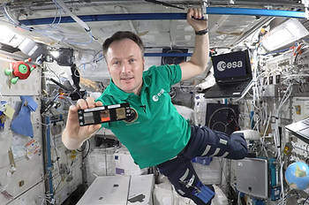 ESA astronaut Matthias Maurer holding the Touch Arrays with the NIMFS during his space classroom. Credit: ESA/NASA