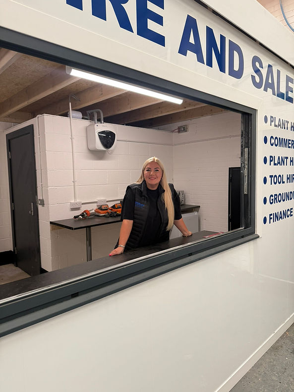 Abi in Beasley Hire and sales uniform at the office