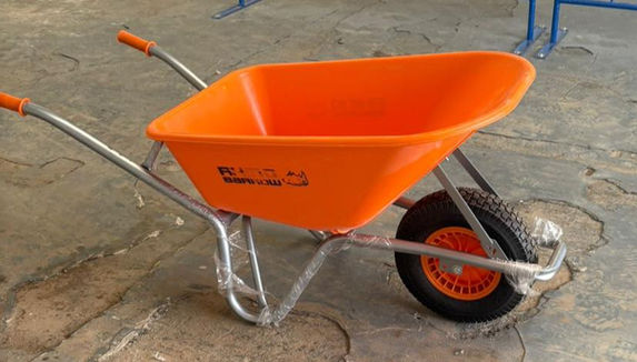 Orange rhino reinforced wheelbarrow side view