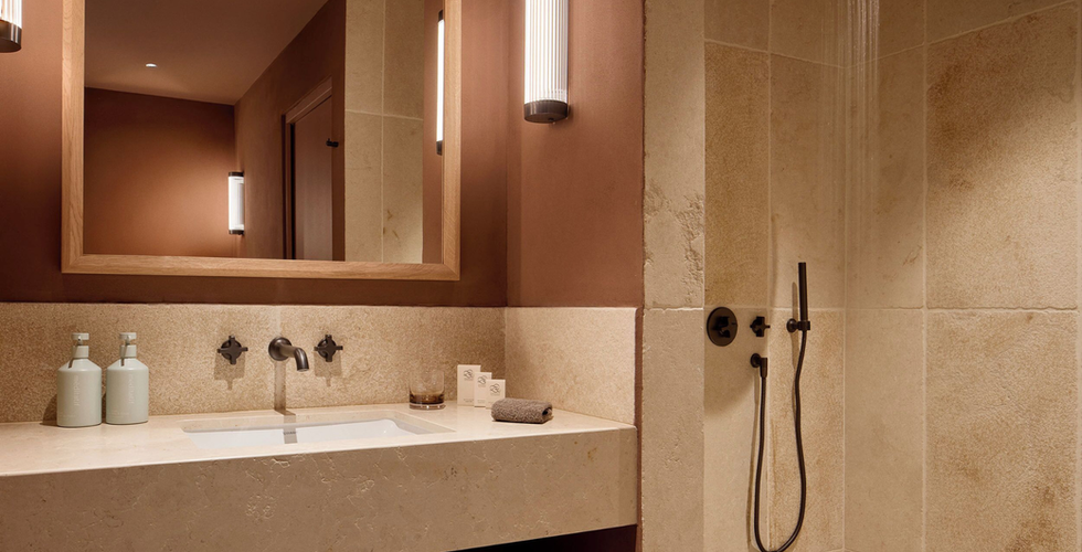 Zannier Ile de Bendor luxury bathroom with travertine tiles