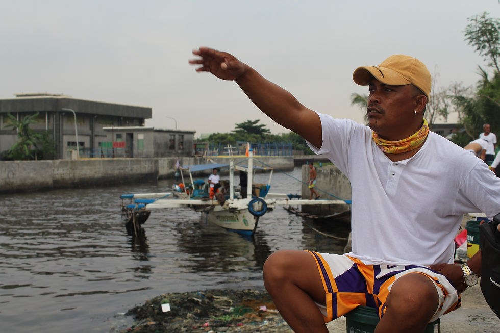 Cabanza waits for the catch of other fisherfolk on May 14, 2023. Photo by Christonette Nuevo.