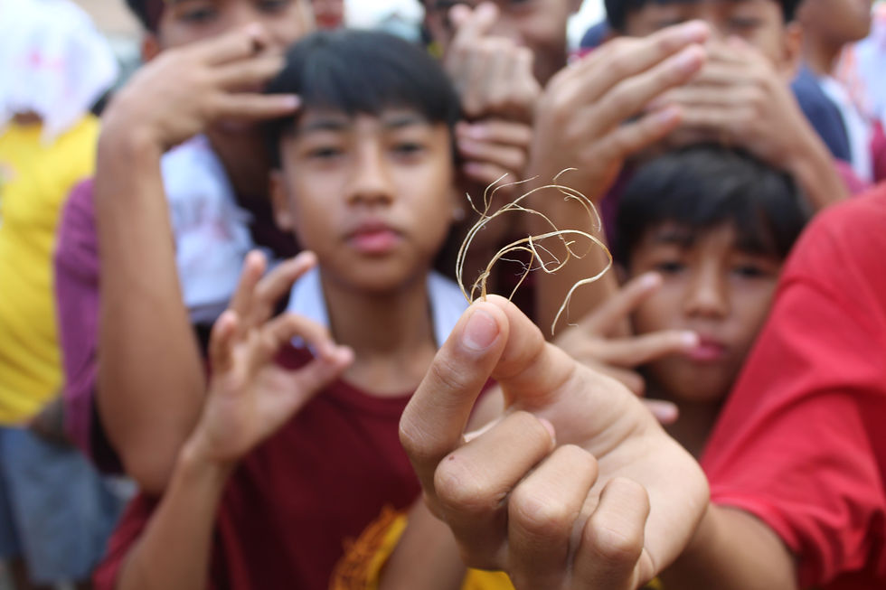 The children dons the abaca fibers from the rope of the Nazarene on January 9, 2024. Photo by Christonette Nuevo.
