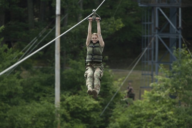 A participant enjoying the zipline at Camp Liberty