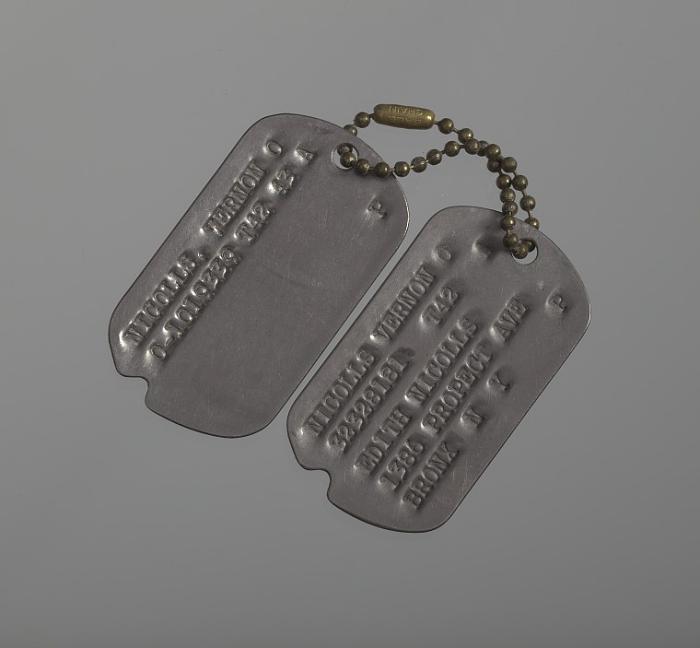 Notched World War II dog tags and chain belonging to Lieutenant Vernon O. Nicolls