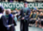 Collin Barker of Wilmington approaches President Corey Cockerill to receive his diploma. Barker graduated summa cum laude with majors in education and history.