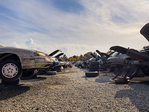 Auto scrap junkyard. Recycling of wrecked automobile used car parts..jpg
