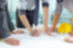 Three pairs of hands sketching a housing project.jpg