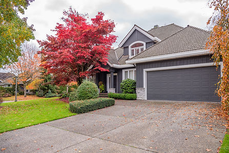 Garage door in luxury house with trees and nice landscape in Fall in Vancouver, Canada, No