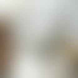 A brand new white close-coupled toilet suite installed in a modern Australian bathroom, with an aged and yellowed toilet pan and separate cistern lying on a canvas drop sheet in the foreground, ready for disposal.