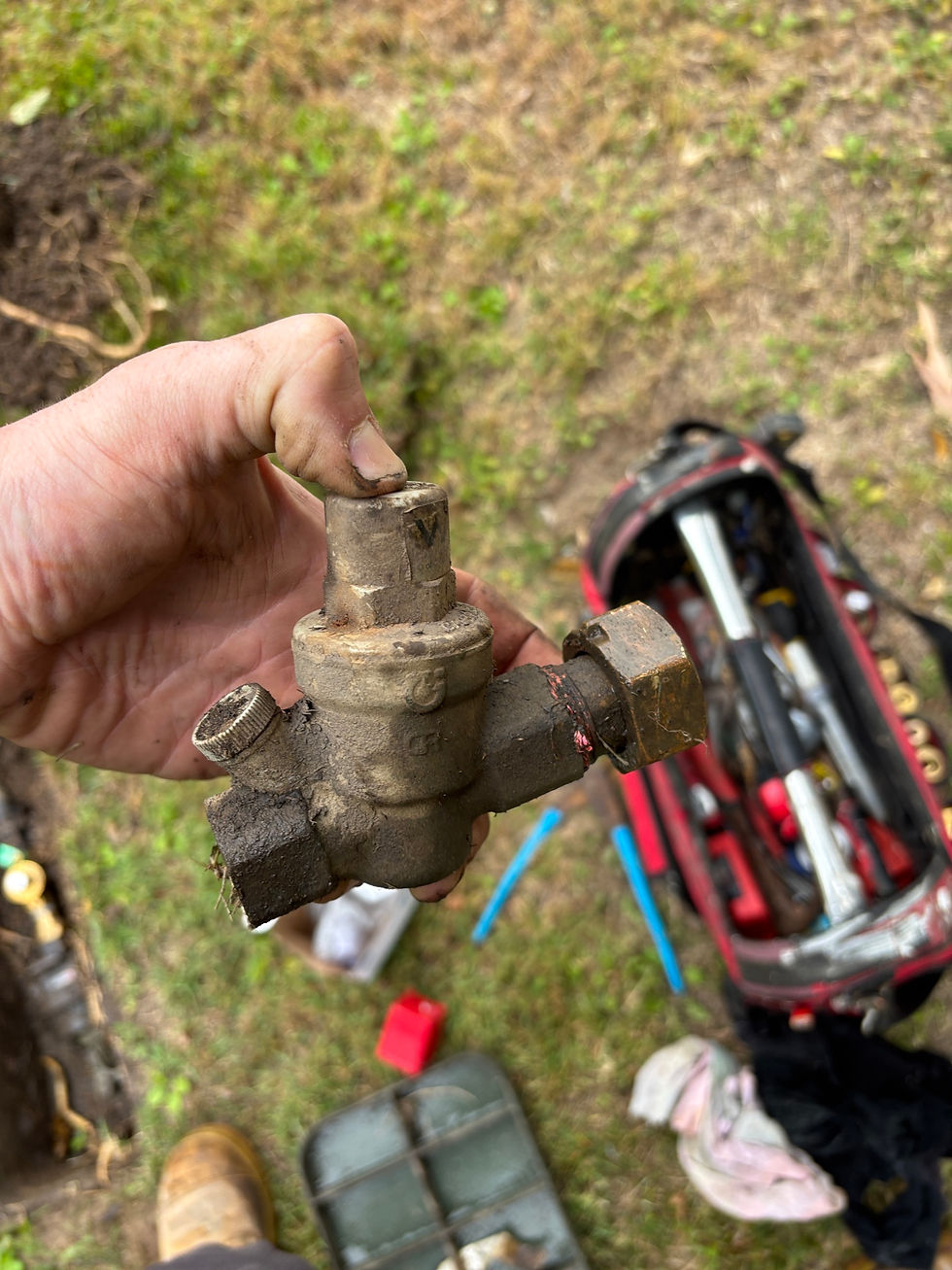 Faulty pressure reduction valve (PRV) removed from water line causing low water pressure throughout the house