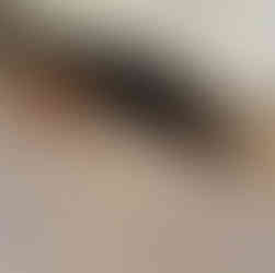 Water damage to bathroom vanity caused by a slow plumbing leak.