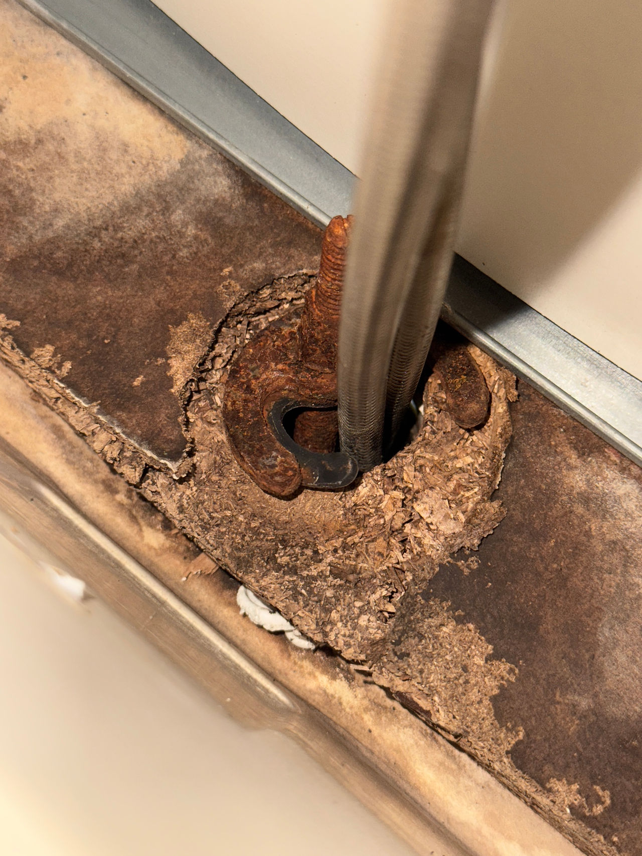 damaged kitchen cabinetry due to leaking sink mixer