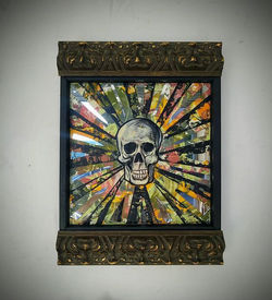 Smiling mirrored skull painting